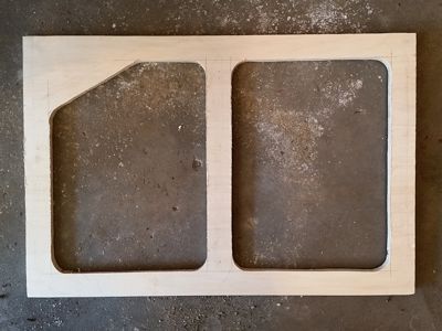 Plywood frame with openings cut in.