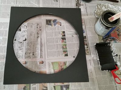 Two coats of flat black latex paint were then applied.