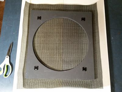 Grille cloth trimmed.