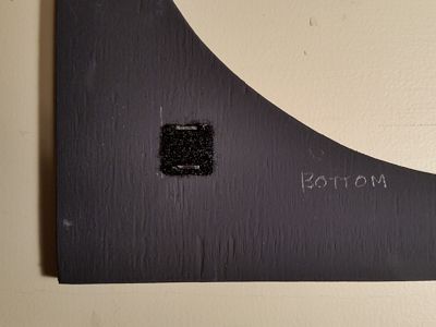 Stapled Velcro in grille frame.