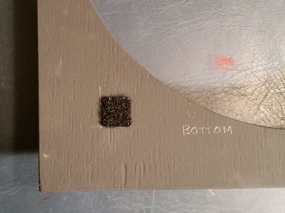 Velcro applied to the grille frame.