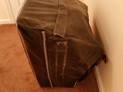 Right side of amplifier in the cover.